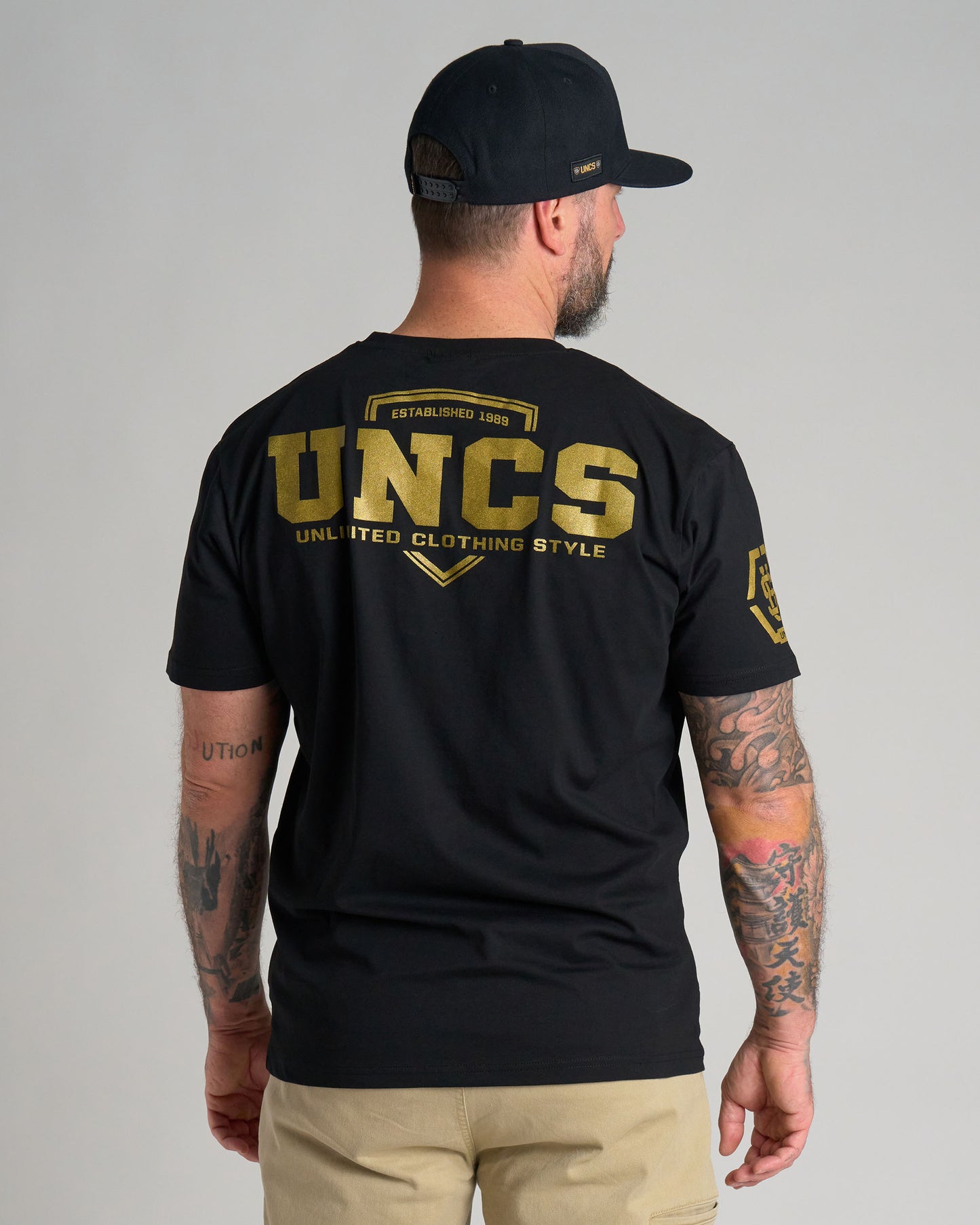 Férfi póló UNCS GOLD BLACK