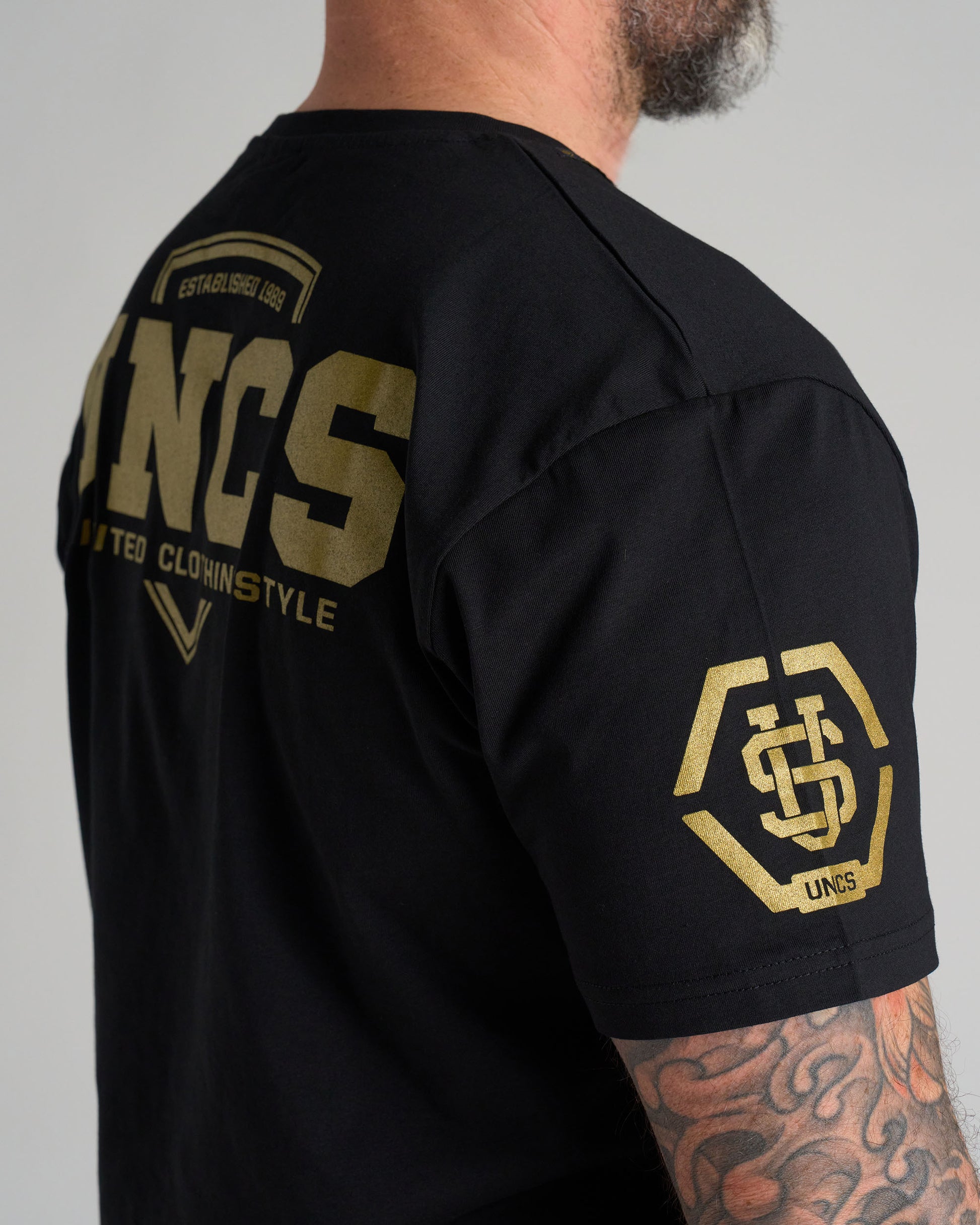 Férfi póló UNCS GOLD BLACK
